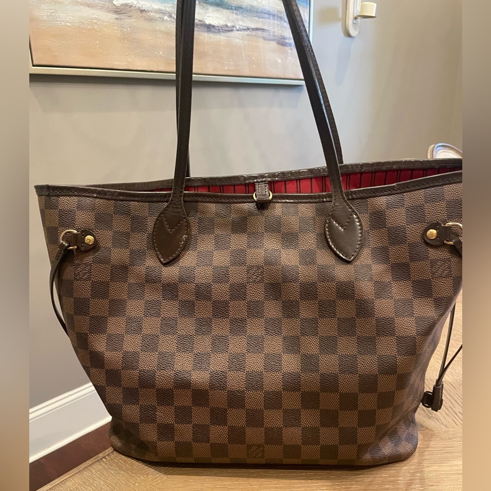 Louis Vuitton Neverfull handbag.